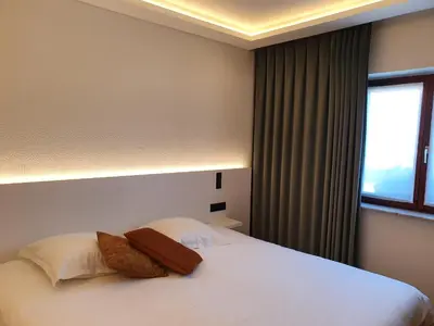 a hotel room with a bed and a window at Kasteel van Nieuwland in Aarschot