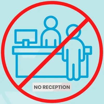 a sign that reads no reception with two people sitting at a desk at Ooostel2.be Leuven in Leuven