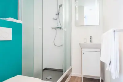 a bathroom with a shower and a sink at Ooostel2.be Leuven in Leuven
