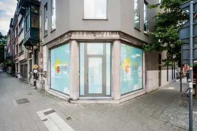 a store window on the side of a building at Ooostel2.be Leuven in Leuven
