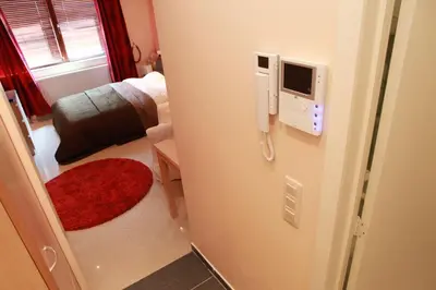 a room with a phone on the wall of a room at Residence la Fraisiere in Brussels