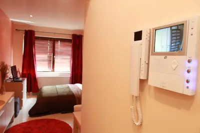 a room with a phone hanging on the wall at Residence la Fraisiere in Brussels