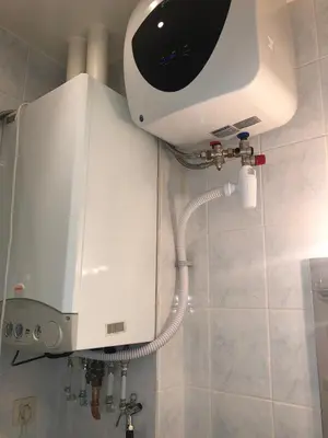 a shower in a bathroom with a hair dryer at Residence la Fraisiere in Brussels