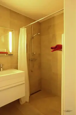 a bathroom with a shower and a sink at Place 2 stay in Ghent