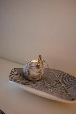 a small candle holder on a table at Hotel Onderbergen in Ghent