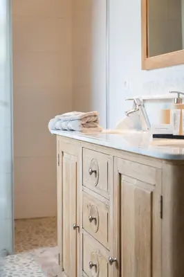a bathroom vanity with a sink and a mirror at Hotel Den Berg in Londerzeel