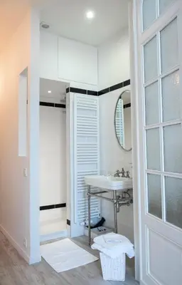 a bathroom with a sink and a mirror at Wok Rooms in Brussels