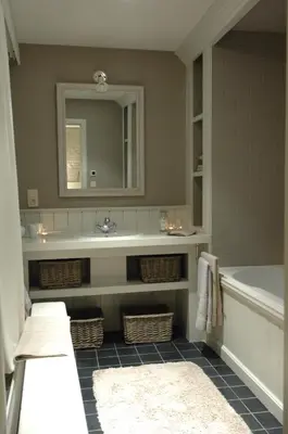 a bathroom with a tub and a sink and a mirror at De Waterzooi Suites in Ghent