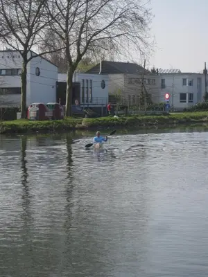 a man in a kayak in a body of water at aan de vaart in Mechelen