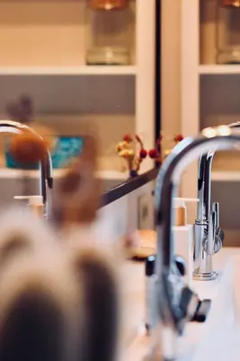 a kitchen with a sink and two faucets at Verne Dreams in Ghent