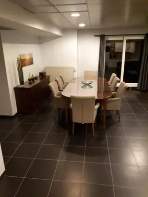 a dining room with a table and chairs at jutta in Mechelen