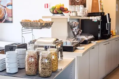 a kitchen with jars of food on a counter at Hobbit Hotel Mechelen in Mechelen