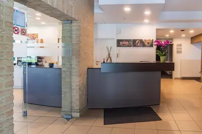 a kitchen with a counter in a room at Hobbit Hotel Mechelen in Mechelen