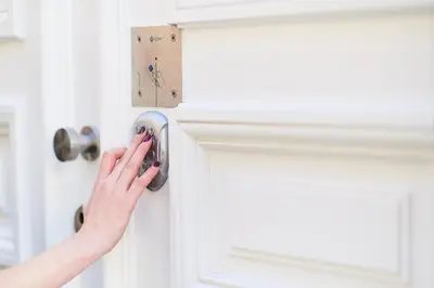 a woman unlocking a door with her hand at B&B X2Brussels in Brussels