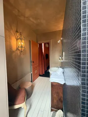 a small bathroom with a sink and a toilet at Guesthouse Nights by Morpheus in Antwerp