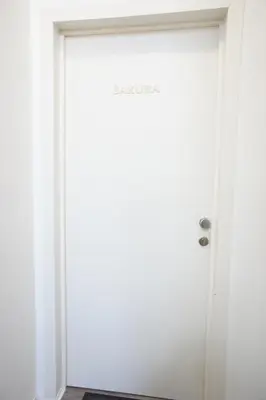 a white door in a room with a rug at Apartments Berlaymont OHY in Brussels