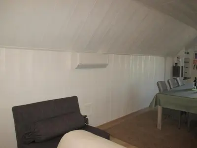 a living room with a couch and a table at Vakantieverblijf-Beestenboel in Retie
