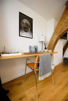 a chair with a towel on it in a room at Les Chambres de Martin in Brussels