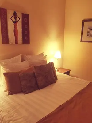 a bedroom with a large bed with aumed at B&B La Ducale in Ghent