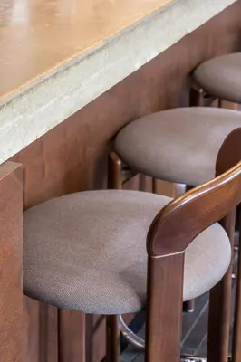 a wooden table with brown chairs around it at Hotel Pilar in Antwerp