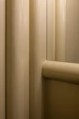 a bathroom door with a mirror on the wall at Hotel Pilar in Antwerp