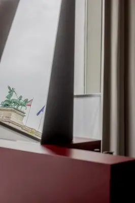 a mirror on top of a table with a window at Hotel Pilar in Antwerp