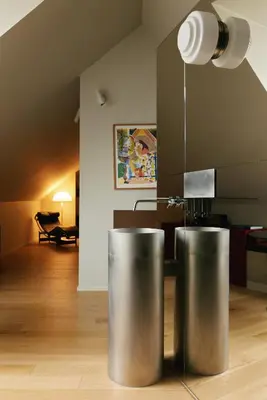 a living room with a table and a lamp at Hotel Pilar in Antwerp
