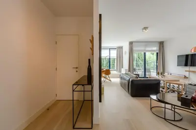 a living room with a couch and a table at The Livorno in Brussels