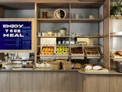 a display case in a bakery with different types of food at ibis budget Gent Centrum Dampoort in Ghent