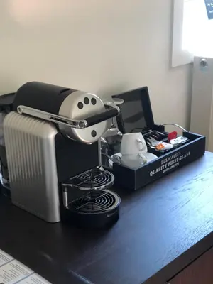 a coffee maker sitting on a counter with a box at Hof Van Volmersele - Luxury B&B in Kampenhout