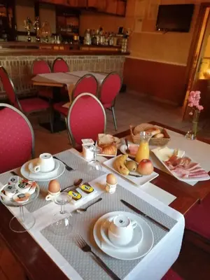 a table with plates of food on top of it at Hotel In Den Hoek in Tielt