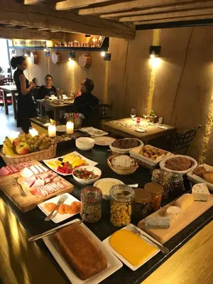 a table with many different types of food on it at Hotel Colvenier in Antwerp