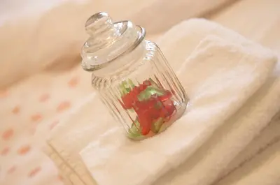a glass jar filled with vegetables on a towel at de minnetuin in Wachtebeke