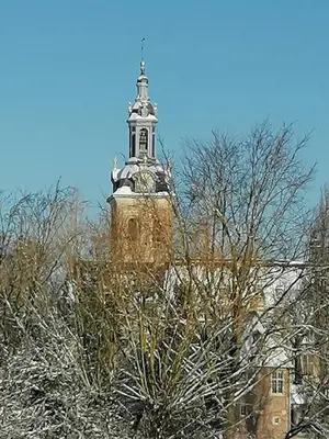 a building with a tower with a steeple on top at Studio's Park - Heverlee in Leuven