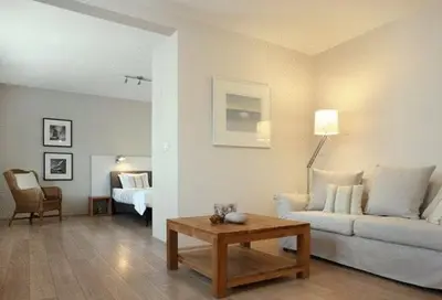 a living room with a couch and a table at midiSud Apartment in Ghent