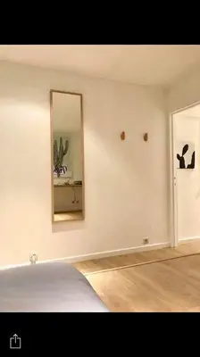 a room with a mirror and a bed in it at Your suite Ghent in Ghent