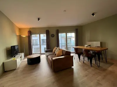 a living room with a couch and a table at Antwerp City Appartment in Antwerp