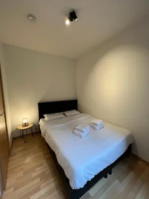 a bedroom with a bed with two towels on it at Antwerp City Appartment in Antwerp