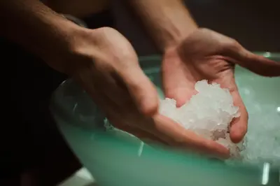 a person holding a pile of snow in their hands at Aspria Royal La Rasante Hotel & Spa in Brussels