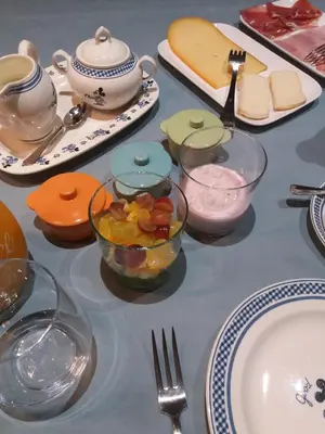 a table topped with plates and bowls of food at Mille Étoiles in Moorsel