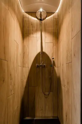 a shower stall with a shower head in a bathroom at Casa Lavanda in Zottegem