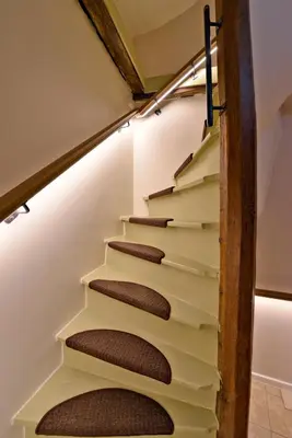 a stairwell in a house withbrown treads at Rooms With A View in Ghent