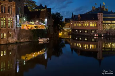 a view of a river with buildings at night at Rooms With A View in Ghent