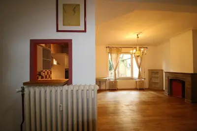 an empty living room with a radiator and a window at Brugman in Brussels