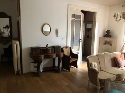 a living room with a table and two chairs at Brugman in Brussels