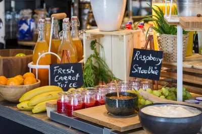 a display of fruit and drinks in jars on a table at Park Inn by Radisson Leuven in Leuven