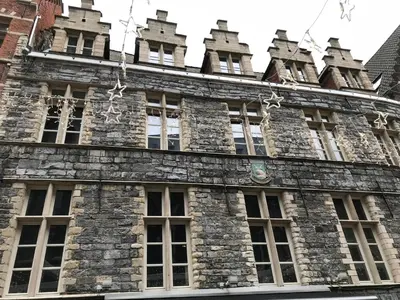 an old stone building with windows and turrets at Living The Dream in Ghent