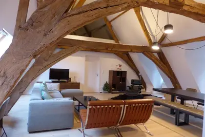a living room with a couch and a table at Living The Dream in Ghent