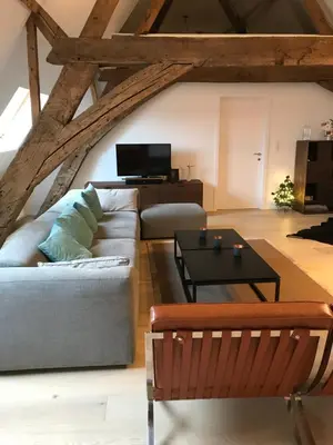 a living room with a couch and a table at Living The Dream in Ghent