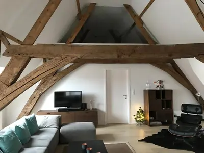 a living room with a couch and a tv at Living The Dream in Ghent
